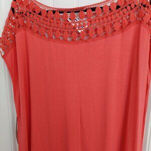 Salmon colored blouse with circular collar design